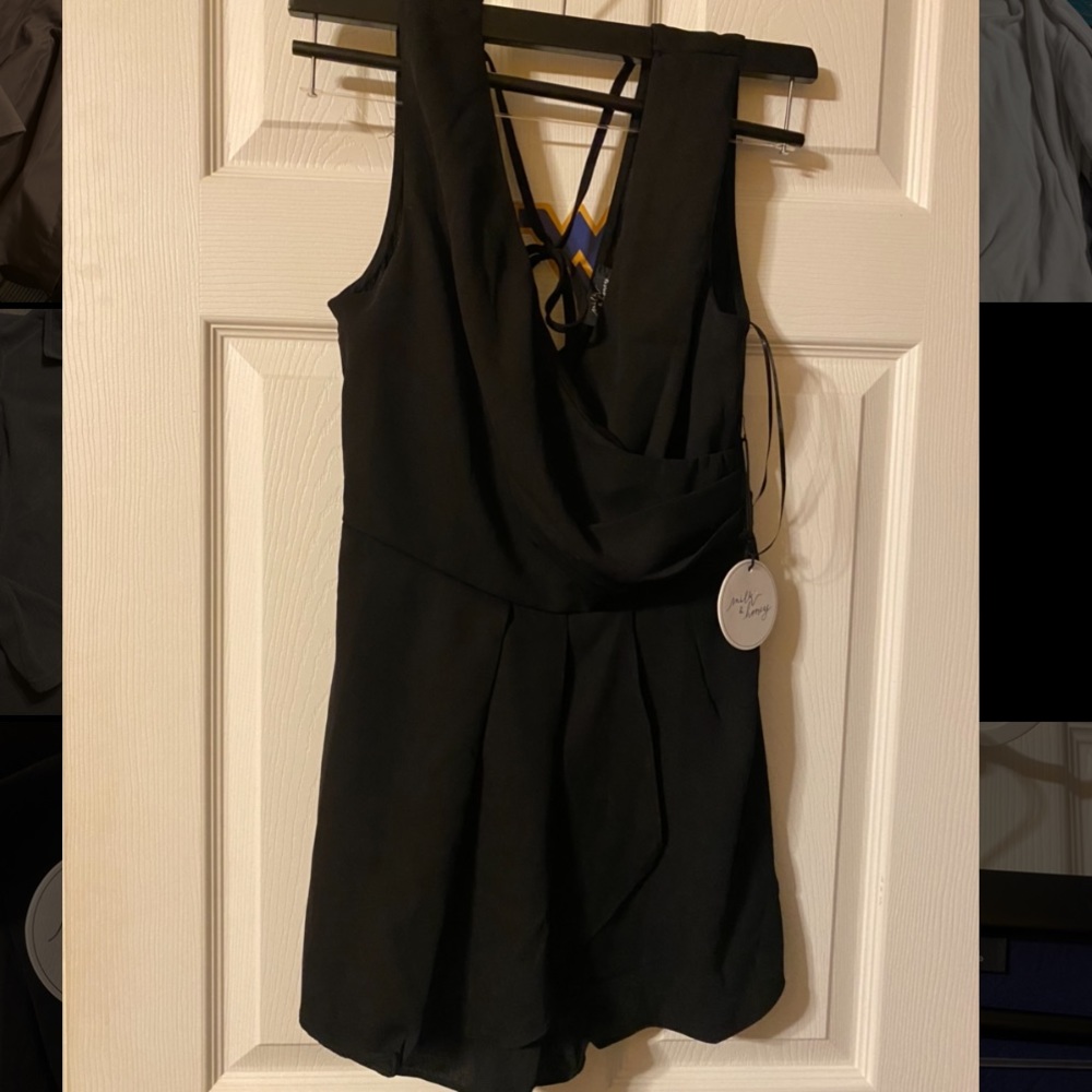 Brand new with tags romper! Size small